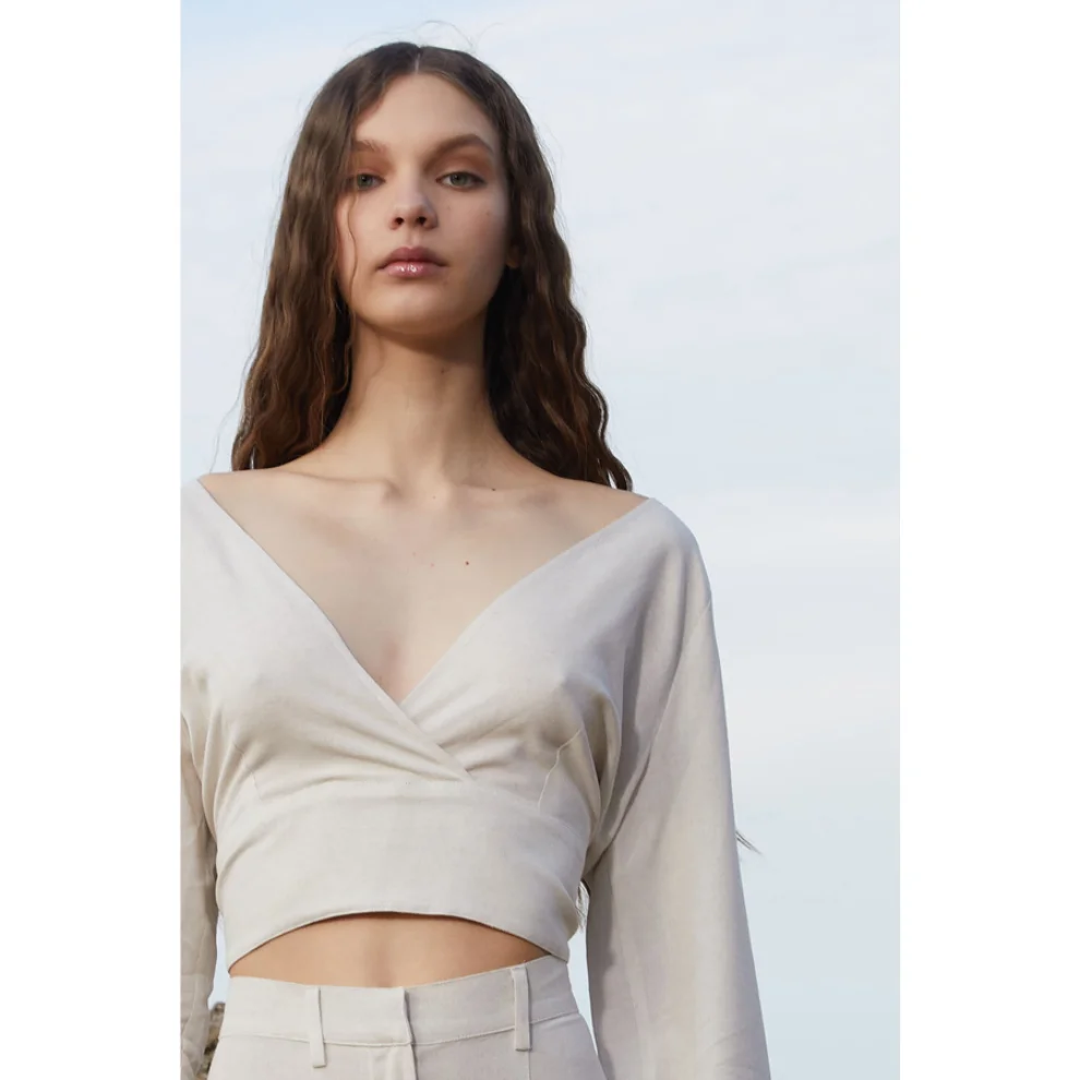 WE OFFICIAL - Linen Wrap Top